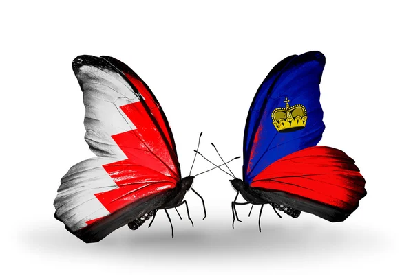 Farfalle con bandiere Bahrain e Liechtenstein sulle ali — Foto Stock