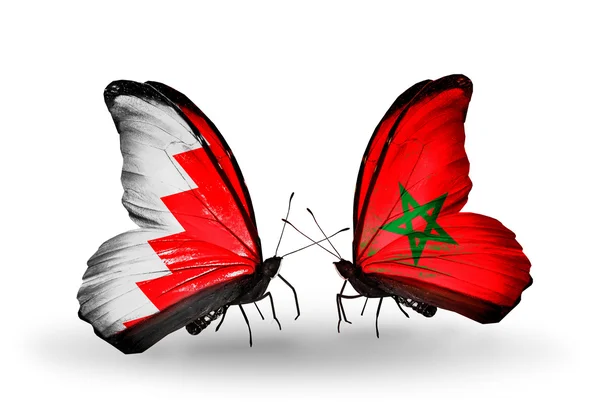 Mariposas con banderas de Bahréin y Marruecos en alas — Foto de Stock