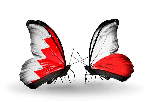 Butterflies with Bahrain and Poland flags on wings — Stock Photo, Image