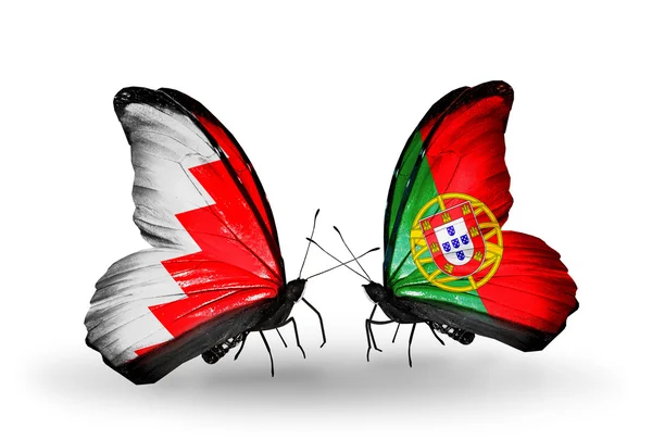 Butterflies with Bahrain and Portugal flags on wings — Stock Photo, Image