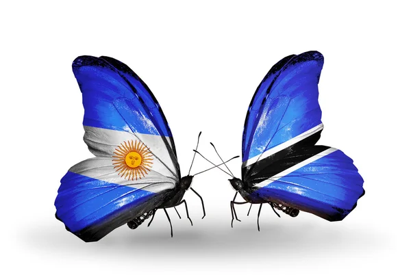Schmetterlinge mit Argentinien- und Botswana-Flaggen auf Flügeln — Stockfoto