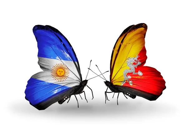 Motýli s Argentinou a Bhútán vlajky na křídlech — Stock fotografie