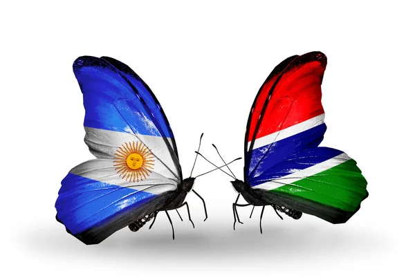 Borboletas com bandeiras da Argentina e Gâmbia em asas — Fotografia de Stock
