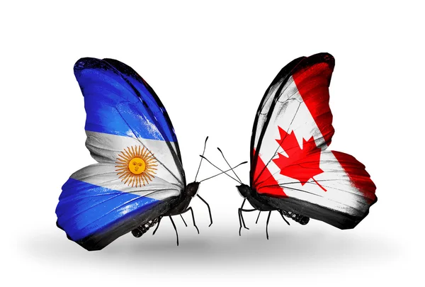蝴蝶翅膀上的阿根廷和加拿大的标志 — 图库照片