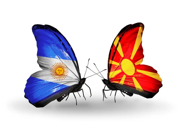 Borboletas com bandeiras da Argentina e Macedônia em asas — Fotografia de Stock