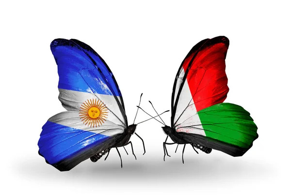 Butterflies with Argentina and Madagascar flags on wings — Stock Photo, Image