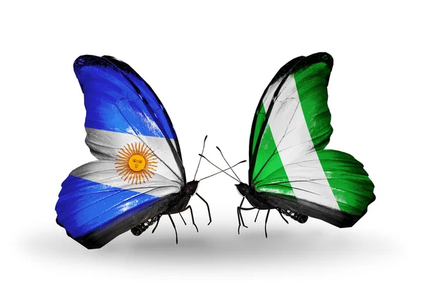 Papillons avec l'Argentine et le Nigeria drapeaux sur les ailes — Photo