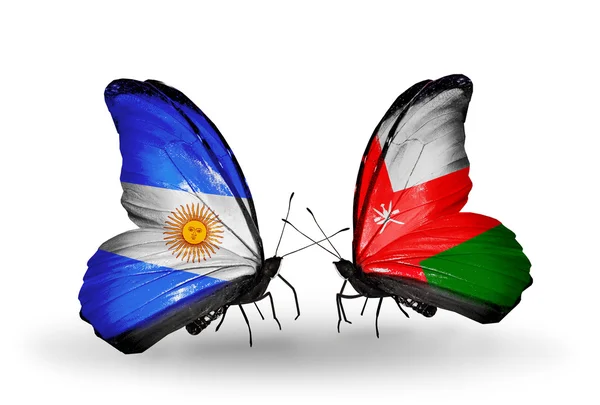 Butterflies with Argentina and Oman flags on wings — Stock Photo, Image