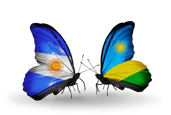 Papillons avec l'Argentine et le Rwanda drapeaux sur les ailes — Photo