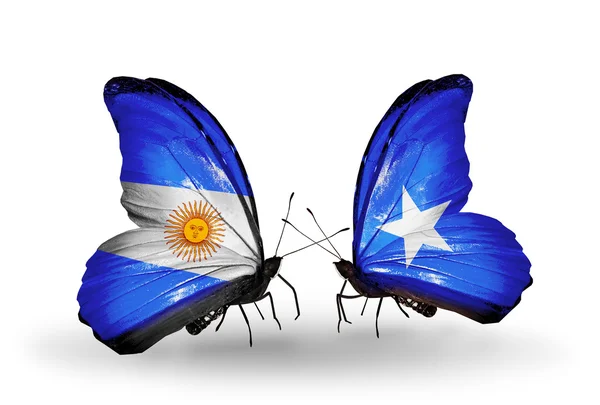 Motýli s Argentinou a Somálsku vlajky na křídlech — Stock fotografie