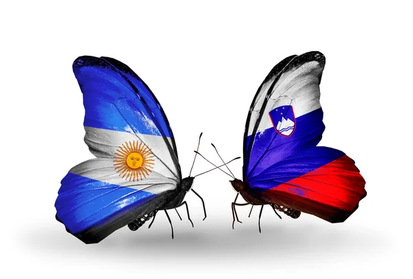 Butterflies with Argentina and Slovenia flags on wings — Stock Photo, Image