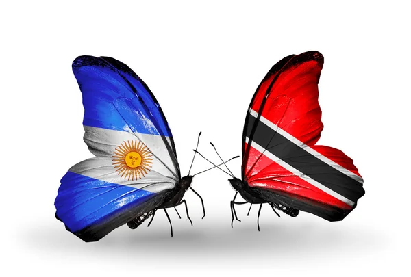 Butterflies with Argentina and Trinidad and Tobago flags on wings — Stock Photo, Image