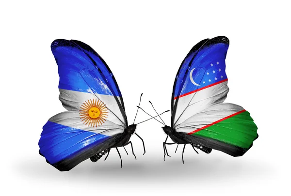 Borboletas com bandeiras da Argentina e do Uzbequistão em asas — Fotografia de Stock