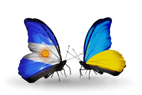 Motýli s Argentinou a Ukrajina vlajky na křídlech — Stock fotografie