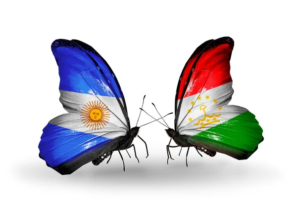 Butterflies with Argentina and Tajikistan flags on wings — Stock Photo, Image