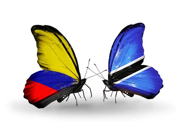 Kelebekler kanat columbia ve Botsvana bayrakları ile — Stok fotoğraf