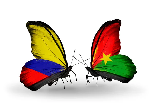 पंखों पर कोलंबिया और बुर्किना फासो ध्वज के साथ तितली — स्टॉक फ़ोटो, इमेज