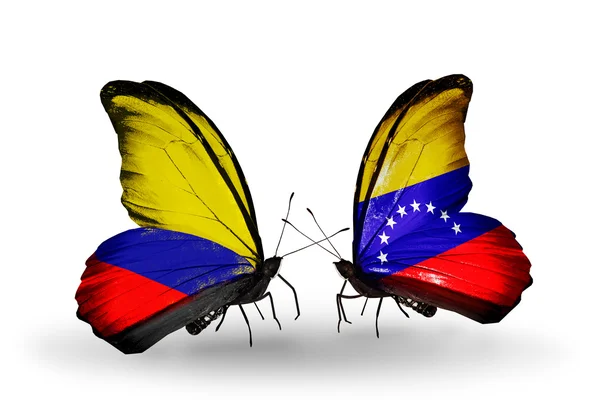 Vlinders met columbia en venezuela vlaggen op vleugels — Stockfoto