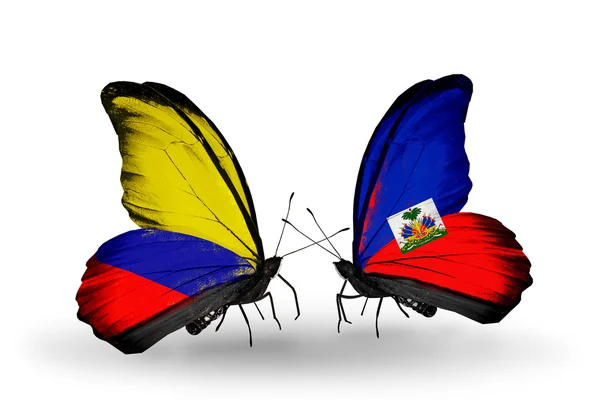 Butterflies with Columbia and Haiti flags on wings — Stock Photo, Image
