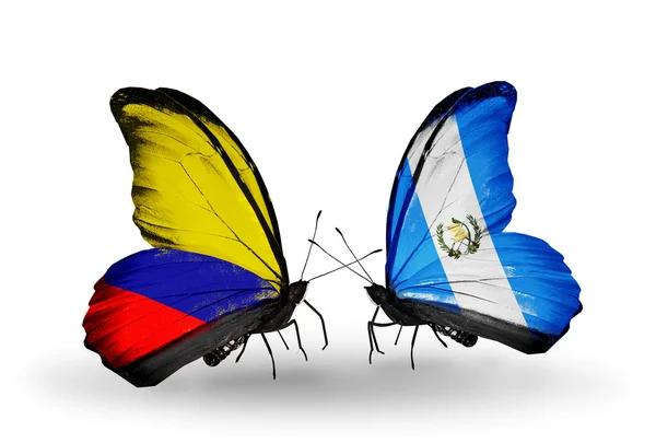 翼の上のコロンビアとグアテマラのフラグと蝶 — ストック写真