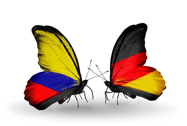 Butterflies with Columbia and Germany flags on wings — Stock Photo, Image