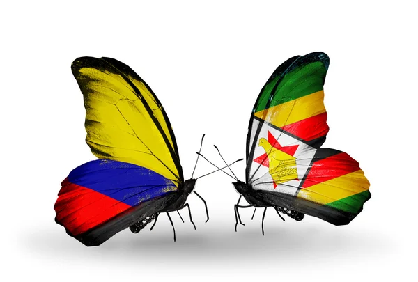 Butterflies with Columbia and Zimbabwe flags on wings — Stock Photo, Image
