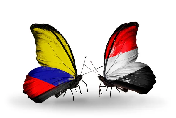 Mariposas con banderas de Colombia y Yemen en alas — Foto de Stock