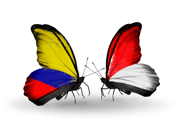 Butterflies with Columbia and Monaco, Indonesia flags on wings — Stock Photo, Image