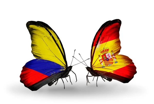 Mariposas con banderas de Colombia y España en alas — Foto de Stock