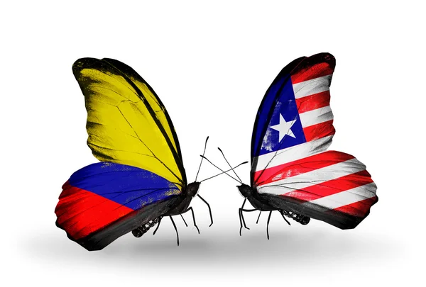 翼の上のコロンビアとリベリアのフラグと蝶 — ストック写真