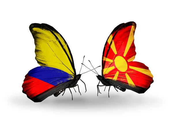 Motyle z Kolumbii i macedonia flagi na skrzydłach — Zdjęcie stockowe