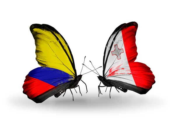 Butterflies with Columbia and Malta flags on wings — Stock Photo, Image