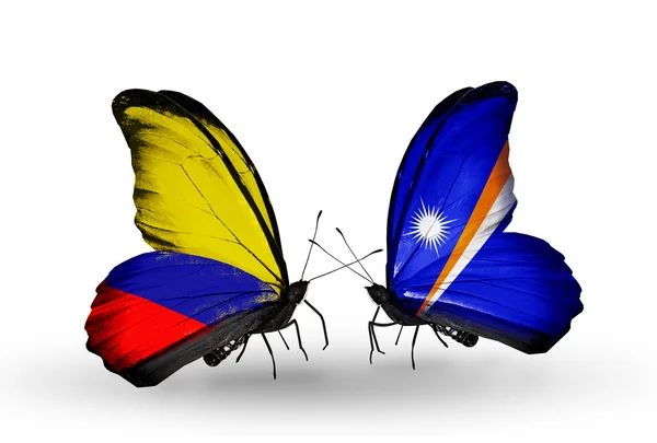 Borboletas com bandeiras da Colômbia e Ilhas Marshall em asas — Fotografia de Stock