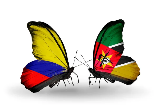 Borboletas com bandeiras Columbia e Moçambique em asas — Fotografia de Stock
