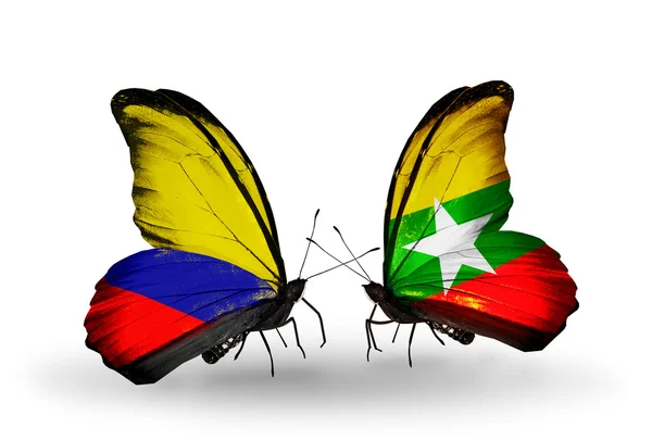 Mariposas con banderas de Colombia y Myanmar en alas — Foto de Stock