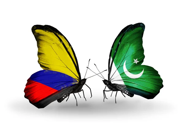 Papillons avec drapeaux Columbia et Pakistan sur les ailes — Photo