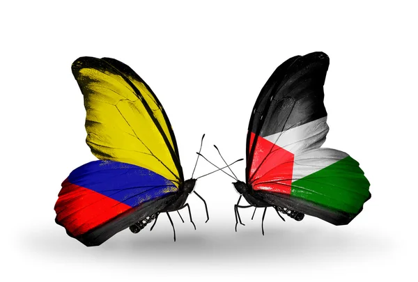 Borboletas com bandeiras da Colômbia e Palestina em asas — Fotografia de Stock