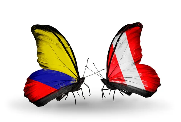 Borboletas com bandeiras Columbia e Peru em asas — Fotografia de Stock
