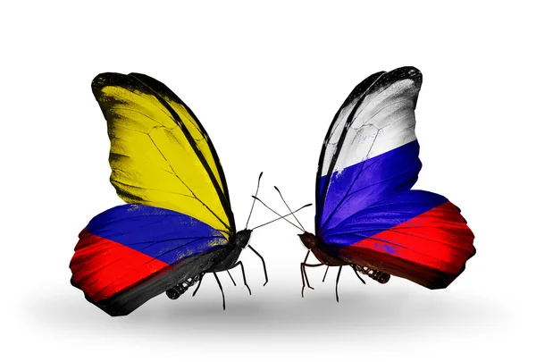 Butterflies with Columbia and Russia flags on wings — Stock Photo, Image