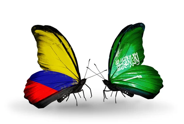 Butterflies with Columbia and Arabia flags on wings — Stock Photo, Image