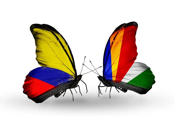 Butterflies with Columbia and Seychelles flags on wings — Stock Photo, Image