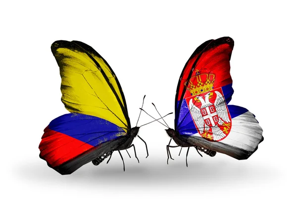 Mariposas con banderas de Colombia y Serbia en alas —  Fotos de Stock