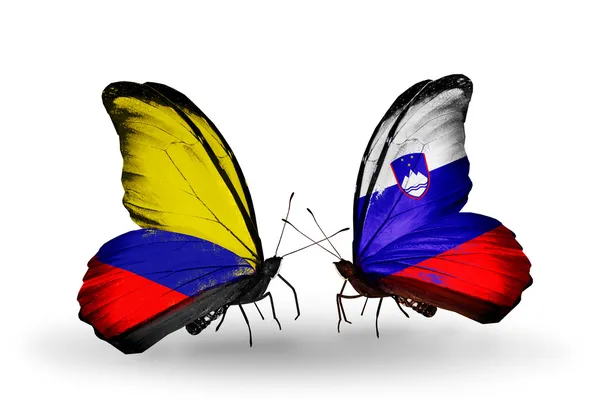 Butterflies with Columbia and Slovenia flags on wings — Stock Photo, Image