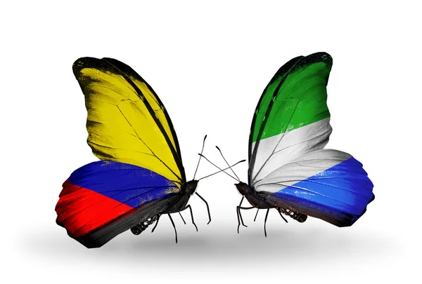 Butterflies with Columbia and Sierra Leone flags on wings — Stock Photo, Image