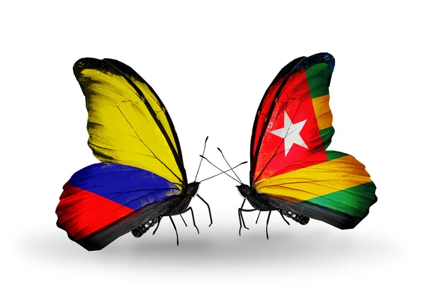 Schmetterlinge mit Kolumbien- und Togo-Flaggen auf Flügeln — Stockfoto