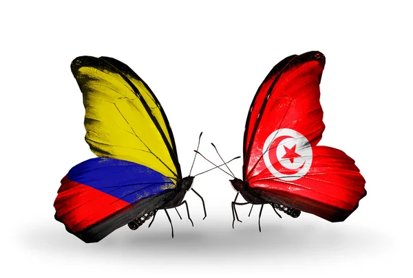 Farfalle con bandiere Colombia e Tunisia su ali — Foto Stock