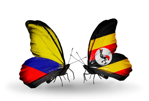 Motýli s příznaky columbia a uganda na křídlech — Stock fotografie