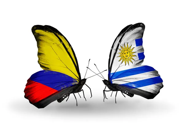 蝶翼にコロンビアとウルグアイの旗 — ストック写真