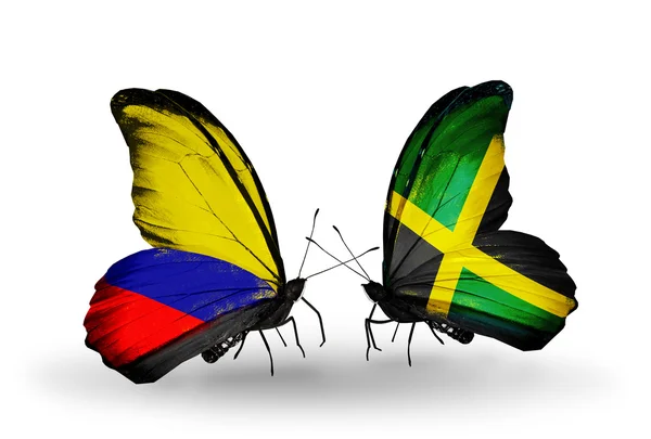 Butterflies with Columbia and Jamaica flags on wings — Stock Photo, Image