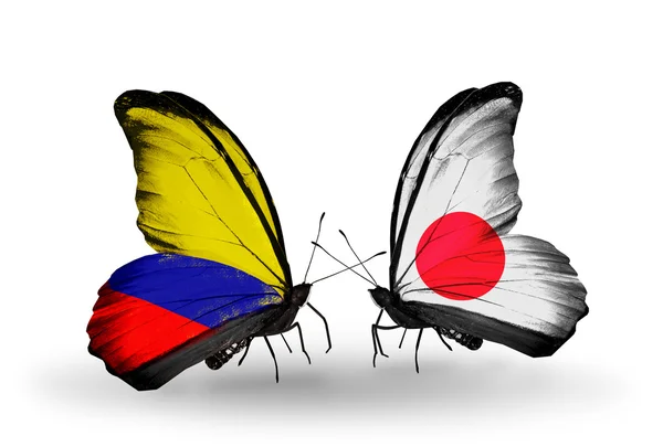 Mariposas con banderas de Colombia y Japón en alas —  Fotos de Stock